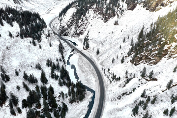 Aerial view of the Richardson Highway, Keystone Canyon, and Lowe River near Valdez, Alaska during the winter.