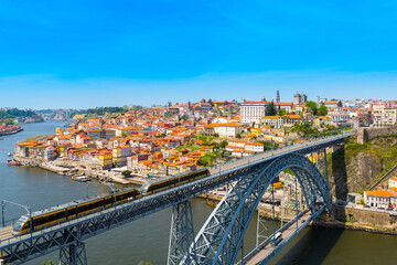 Panoramic view of Porto with Dom Luis I Bridge over the Douro River at sunny day