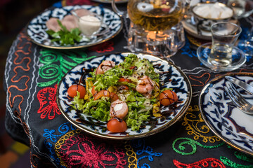 Salad with red fish in an oriental restaurant