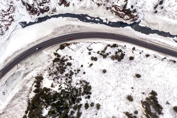 Aerial view of the Richardson Highway, Keystone Canyon, and Lowe River near Valdez, Alaska during the winter.