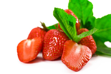 Fresh mint and juicy strawberries isolated on a white background.