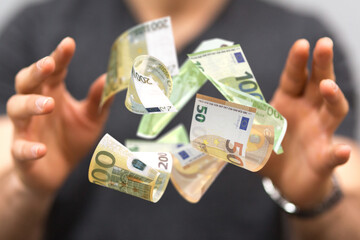 money euro banknote in hand rain