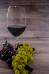 Red wine glass and grapes
