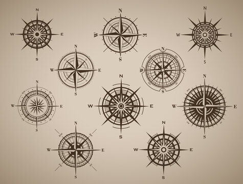 Set of compass rose or wind rose on brown vintage background