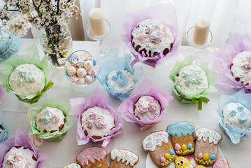 Beautiful Easter cakes on a decorated light table. A light holiday of Easter.