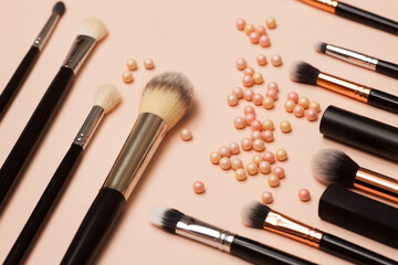 Various Cosmetic Brushes on Pink Background. Makeup Brushes Set for Take Care Skin.