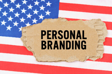 On the US flag lies a cardboard box with the inscription- PERSONAL BRANDING