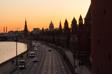 Moscow, Russia. The Moscow Kremlin  in sunset. Kremlevskaya embankment, traffic. Ministry of Foreign Affairs  building in background