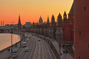 Moscow,Russia. HDR image of the Moscow Kremlin  in sunset. Kremlevskaya embankment;traffic. Ministry of Foreign Affairs  building in background