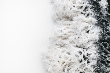 Knitted fabric with fringe on a decorative background