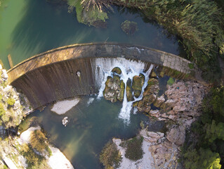 drone view of the reservoir and waterfall on the Serpis greenway in Alcoy, located in Alicante, Spain