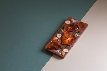 beautiful handmade chocolate with pieces of fruit and nuts  with space for text