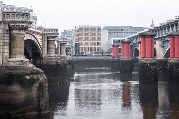 Naklejka premium River Thames and London bridges. London in rain. London during national lockdown UK, 2021