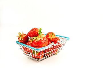 Grocery basket with strawberries on an isolated white background. The concept of online shopping on...