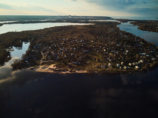drone aerial photo of flight above the river at sunset time.