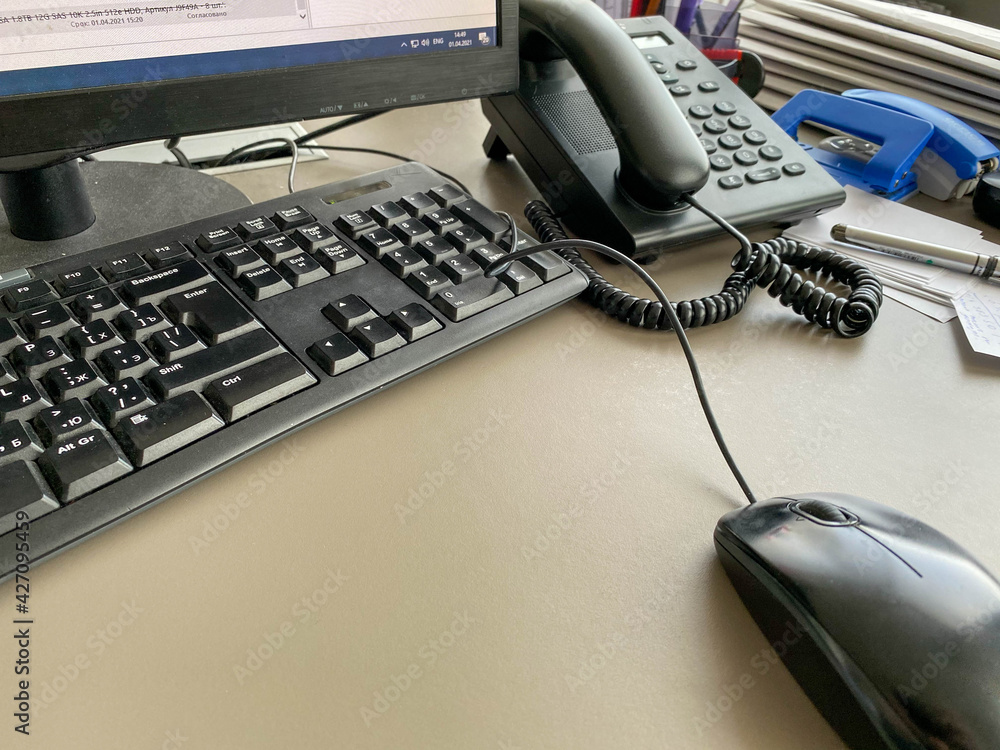 Poster black modern computer mouse keyboard and telephone on a working office table in a business company