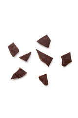 Top view of dark chocolate pieces isolated on white background