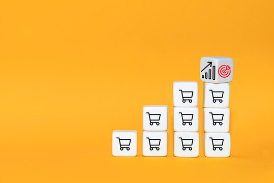 Sale volume increase make business grow. The cube turns over with icon goal and shopping cart symbol.