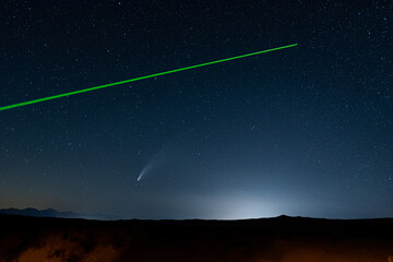 Comet with laser pointer on the north start