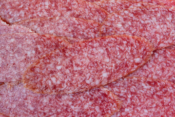 Background from sliced ​​smoked sausages.