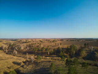 Naklejka premium drone photo of flight above the fields and canyons