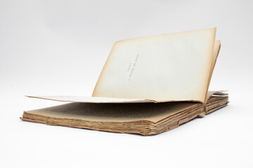 Antique open book isolated with flipping pages on white background