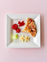 Fun kids food creatively arranged to entice healthy eating for children's meals. Photo concept, creative food, background, copy space