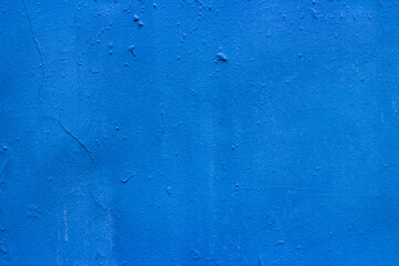 Old wall painted with blue paint background image 
