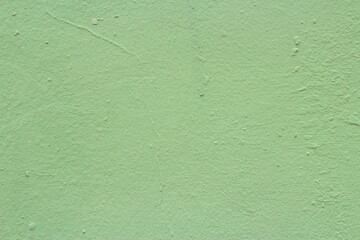 Old wall painted with green turquoise paint background image 