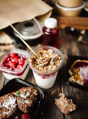 different food from delivery. catering food, takeaway. food for the company in disposable dishes. food delivery with place for brand or text
