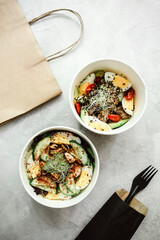 different food from delivery. catering food, takeaway. food for the company in disposable dishes. food delivery with place for brand or text
