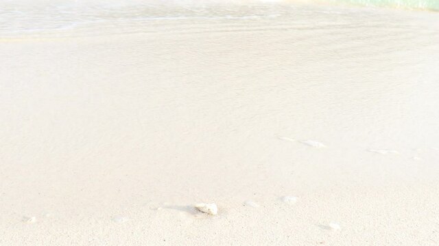 Ocean waves crashing on white sand beach, beautiful natural scene of tropical summer sea beach.