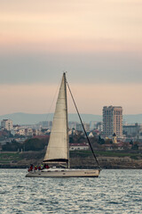 Sevastopol. Crimea. Autumn 2020. The yacht enters the bay of Sevastopol. The yacht goes under the mainsai.