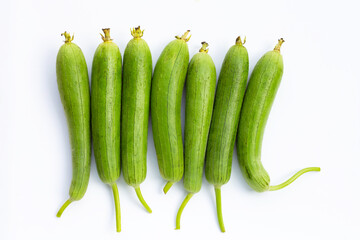 Fresh green sponge gourd or luff on white.