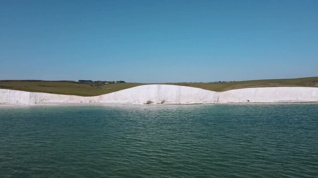 Aerial view of the Seven Sisters Chalk Cliffs Edge on a sunny warm day. South of England