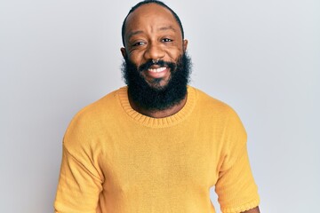 Young african american man wearing casual clothes with a happy and cool smile on face. lucky person.