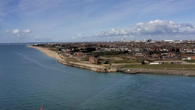 Aerial Footage over the estuary at Southsea approaching Fort Cumberland on a beautiful clear and sunny Spring day in Southern England.