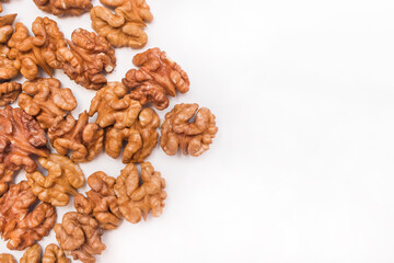 Peeled walnut halves on a white background isolated for design, copy space and mock up