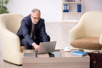Old businessman employee waiting for business meeting
