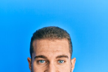 Young caucasian man showing head and half face smiling with a happy and cool smile on face. showing teeth.