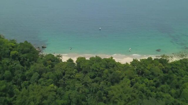 Aerial and slow motion view of a paradisiacal beach in the Angra dos Reis bay, Rio de Janeiro, Brazil