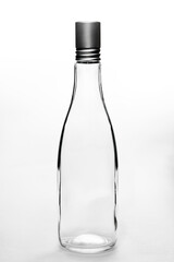 empty clear glass bottle white background