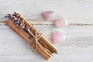 A top view image of several pieces of holy wood and healing crystals. 