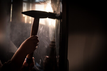 Cute little girl standing in front of a TV with broken screen holding a hammer. Home insurance...