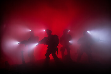 Anti-riot police give signal to be ready. Government power concept. Police in action. Smoke on a...
