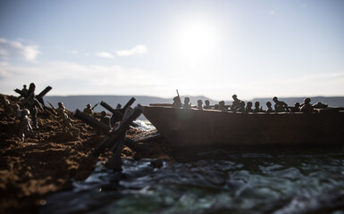 World War 2 reenactment (D-day). Creative decoration with toy soldiers, landing crafts and...