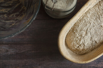 A close up view of a basket with sourdough bread before leavening and baking.