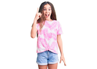 Obraz na płótnie Canvas Cute hispanic child girl wearing casual clothes pointing finger up with successful idea. exited and happy. number one.