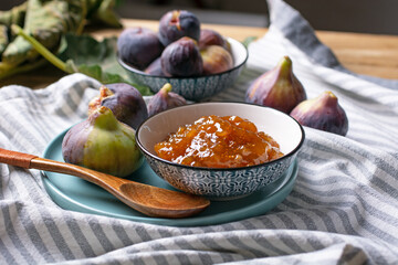 Homemade fig jam with fruits around - closeup