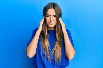 Young hispanic woman wearing casual clothes covering ears with fingers with annoyed expression for the noise of loud music. deaf concept.